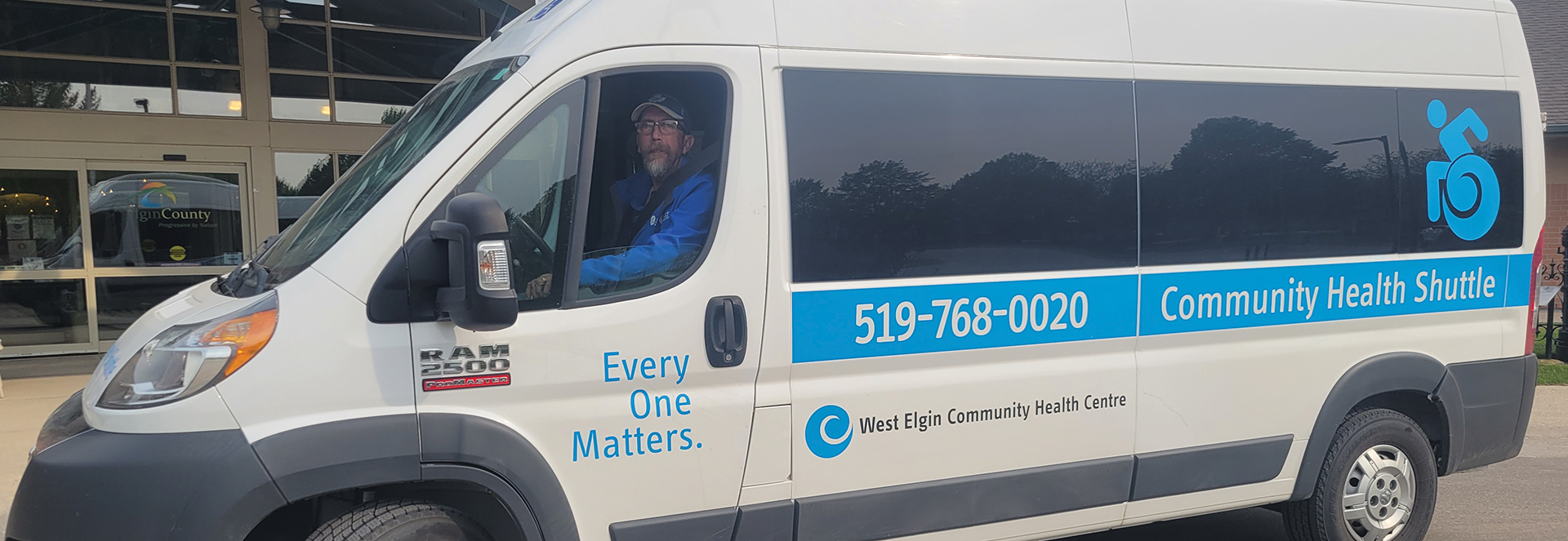 Dave Peskar sits in the driver’s seat of a mobility van that helps with the West Elgin Community Health Centre’s Gift-a-Ride program.