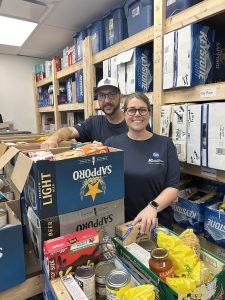 IG Wealth volunteers stocking food shelves