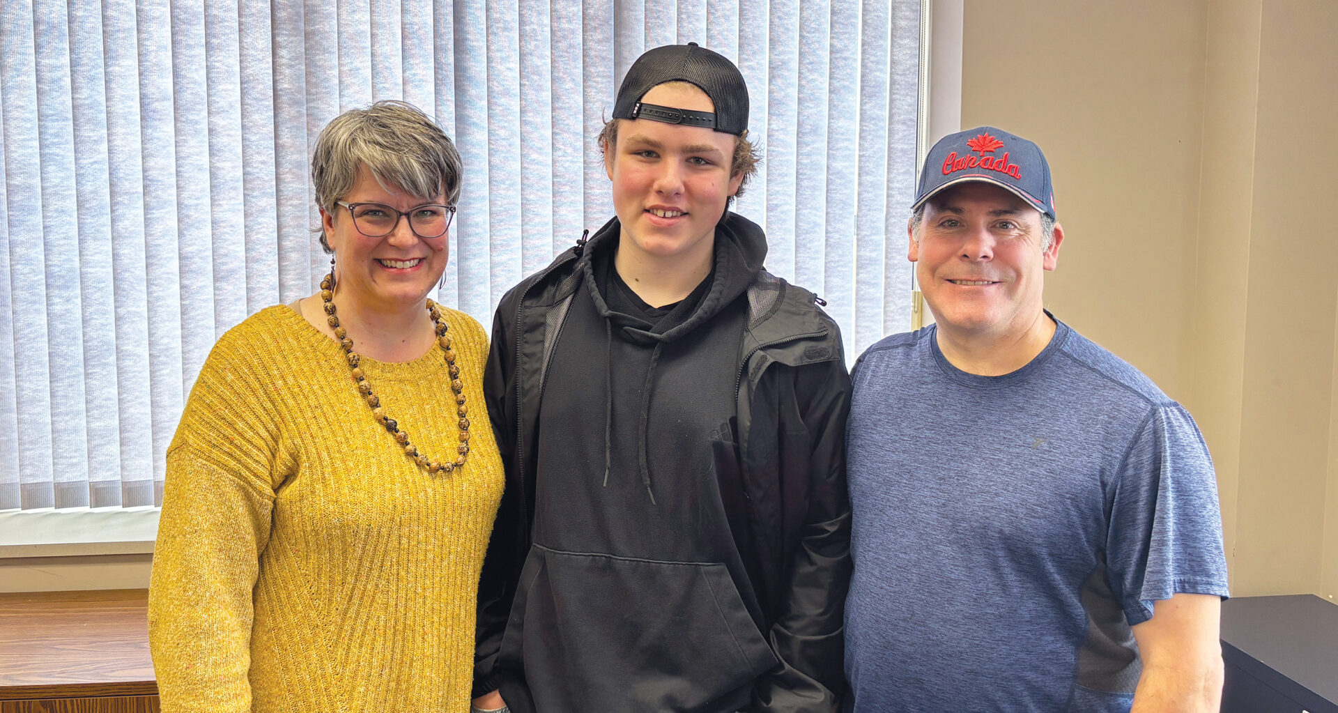 Logan, program participant at United Way funded program at Learning Disabilities Association of London Region and his parents, Tina and Randi