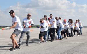 Canada Life team White ready at the rope to pull their plane