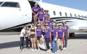 Women United team with BFitness volunteers getting ready to do their second pull